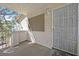 Private patio featuring a security door with decorative details and textured stucco walls at 1313 Pinto Rock Ln # 202, Las Vegas, NV 89128