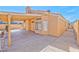 This backyard features a covered patio and concrete hardscape at 1437 Daybreak Dr, Las Vegas, NV 89108