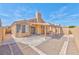 This backyard features a covered patio area and low-maintenance landscaping at 1437 Daybreak Dr, Las Vegas, NV 89108