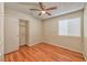 Cozy bedroom featuring wood floors, a ceiling fan, and a closet, creating a comfortable and inviting space at 1437 Daybreak Dr, Las Vegas, NV 89108