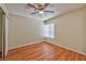 This bedroom features wood laminate floors, neutral walls, and a ceiling fan at 1437 Daybreak Dr, Las Vegas, NV 89108