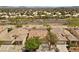 An aerial view shows the roof and neighborhood of a single-story home, plus lush greenery and beautiful landscaping at 1524 Remembrance Hill St, Las Vegas, NV 89144