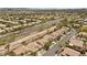 A lovely aerial shot shows a neighborhood community, highlighting the street and nearby desert landscape at 1524 Remembrance Hill St, Las Vegas, NV 89144