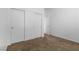 This bedroom features closet doors, neutral carpet and white walls for a clean and serene space at 1524 Remembrance Hill St, Las Vegas, NV 89144