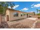 Exterior back view of the house showing desert landscaping and patio at 1524 Remembrance Hill St, Las Vegas, NV 89144