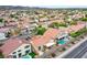 Nice aerial view of a neighborhood showcasing community pools and well-kept landscaping at 1552 Livingston Dr, Henderson, NV 89012