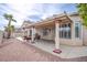 A backyard with decorative rock, patio, and pillars with string lights at 1552 Livingston Dr, Henderson, NV 89012