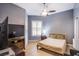 This bedroom includes a full size bed, TV and shuttered window for a relaxing ambiance at 1552 Livingston Dr, Henderson, NV 89012