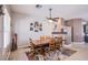 Elegant dining room with wood furniture, decor, a rug and a stylish ceiling fan at 1552 Livingston Dr, Henderson, NV 89012