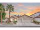 Charming single-story home featuring a well-maintained lawn, mature trees, and a spacious three-car garage at 1552 Livingston Dr, Henderson, NV 89012