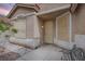 Inviting front entrance with textured walls, stone accents, stylish window and a cozy bench at 1552 Livingston Dr, Henderson, NV 89012