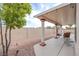 Backyard patio with string lights and decorative rock landscaping at 1552 Livingston Dr, Henderson, NV 89012
