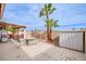 Relaxing covered patio with a seating area, barbeque grill, and view of palm trees at 1552 Livingston Dr, Henderson, NV 89012