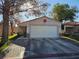Charming single-story home with a two-car garage and a well-maintained front yard in a quiet neighborhood at 1821 Windy Gap St, Las Vegas, NV 89106