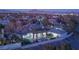 Expansive estate featuring beautiful landscaping, pool, and a multi-car garage, set against a backdrop of mountains at 1865 Woodhaven Dr, Henderson, NV 89074