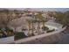 Luxurious home featuring a private pool, spacious patio, and well-maintained landscaping at 1865 Woodhaven Dr, Henderson, NV 89074