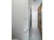 Bathroom view showing a shower and wood-look door at 1865 Woodhaven Dr, Henderson, NV 89074