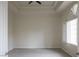 Well-lit bedroom with neutral walls, carpet floors, and a large window with plantation shutters at 1865 Woodhaven Dr, Henderson, NV 89074