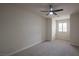 Bedroom featuring neutral walls and carpets, with a modern ceiling fan at 1865 Woodhaven Dr, Henderson, NV 89074