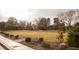 Open community park with picnic tables, playgrounds, mature landscaping, and walking paths at 1865 Woodhaven Dr, Henderson, NV 89074