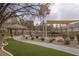 Community park with a covered picnic area, lush green grass, and mature landscaping at 1865 Woodhaven Dr, Henderson, NV 89074