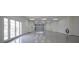 Spacious garage with polished floors, bright lighting, and ample room for multiple vehicles and storage at 1865 Woodhaven Dr, Henderson, NV 89074
