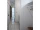Tiled hallway leads into a closet and bathroom at 1865 Woodhaven Dr, Henderson, NV 89074