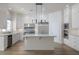 Bright kitchen with white cabinetry, stainless steel appliances, and a center island for meal prep at 1865 Woodhaven Dr, Henderson, NV 89074