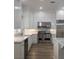 Updated kitchen featuring a stainless steel range, bright white cabinets and marble countertops at 1865 Woodhaven Dr, Henderson, NV 89074