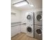 Bright laundry room with modern washer and dryer units and granite countertops at 1865 Woodhaven Dr, Henderson, NV 89074