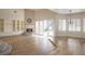 Spacious living room with fireplace, hardwood floors and sliding glass doors to the back patio at 1865 Woodhaven Dr, Henderson, NV 89074