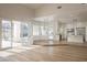 Spacious living room with backyard access and views into the dining room and kitchen at 1865 Woodhaven Dr, Henderson, NV 89074