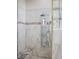 Luxurious walk-in shower with marble finish, rainfall shower head, and seating at 1865 Woodhaven Dr, Henderson, NV 89074