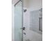 Walk-in shower with glass doors, subway tile surround, and built-in niche at 1865 Woodhaven Dr, Henderson, NV 89074