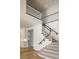 Elegant staircase with black and white railings and carpeted steps at 1865 Woodhaven Dr, Henderson, NV 89074