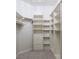 Organized walk-in closet with custom shelving, drawers, and ample storage space at 1865 Woodhaven Dr, Henderson, NV 89074