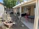 Spacious backyard featuring a hot tub, fire pit, and covered patio, great for outdoor living at 1901 Rolling Dunes Ct, Las Vegas, NV 89117