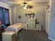 Charming bedroom with ceiling fan, carpet floors, matching bedside tables and spacious closet for storage at 1901 Rolling Dunes Ct, Las Vegas, NV 89117
