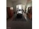 Elegant dining room with a long table, rug, and wooden furniture at 1901 Rolling Dunes Ct, Las Vegas, NV 89117