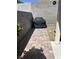 Outdoor grill nestled on a paved walkway with block wall perimeter at 1901 Rolling Dunes Ct, Las Vegas, NV 89117