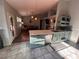 Open-concept kitchen with tiled floors, a peninsula counter, and stainless steel appliances at 1901 Rolling Dunes Ct, Las Vegas, NV 89117