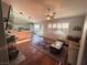 Open floor plan with tile flooring, neutral paint, a ceiling fan and a view of the kitchen at 1901 Rolling Dunes Ct, Las Vegas, NV 89117
