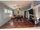 Bright living room featuring tile flooring, a cozy fireplace, neutral paint and a ceiling fan at 1901 Rolling Dunes Ct, Las Vegas, NV 89117