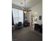 Bright home office featuring a ceiling fan, large window, and two desks at 1901 Rolling Dunes Ct, Las Vegas, NV 89117