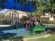 Community playground with play structures and benches offers enjoyment for children at 1901 Rolling Dunes Ct, Las Vegas, NV 89117