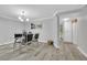 Bright dining room with a glass-top table and sleek black chairs at 2080 Karen Ave # 1, Las Vegas, NV 89169