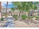 Beautifully landscaped complex with mature trees, shrubs, gravel, and walkways at 2080 Karen Ave # 1, Las Vegas, NV 89169