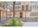 Apartment complex featuring balconies, secure entry doors, courtyard, and mature tree at 2080 Karen Ave # 1, Las Vegas, NV 89169