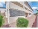 Exterior view of the building featuring well-maintained landscaping, architectural details, and private patio at 2080 Karen Ave # 1, Las Vegas, NV 89169