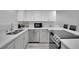 Bright kitchen featuring white cabinets, stainless steel appliances, and a modern countertop at 2080 Karen Ave # 1, Las Vegas, NV 89169